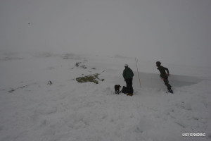 Snow Ranger speaking with a member of the party reporting the collapse. A quick snow profile was performed here on the right flank before clouds closed in.