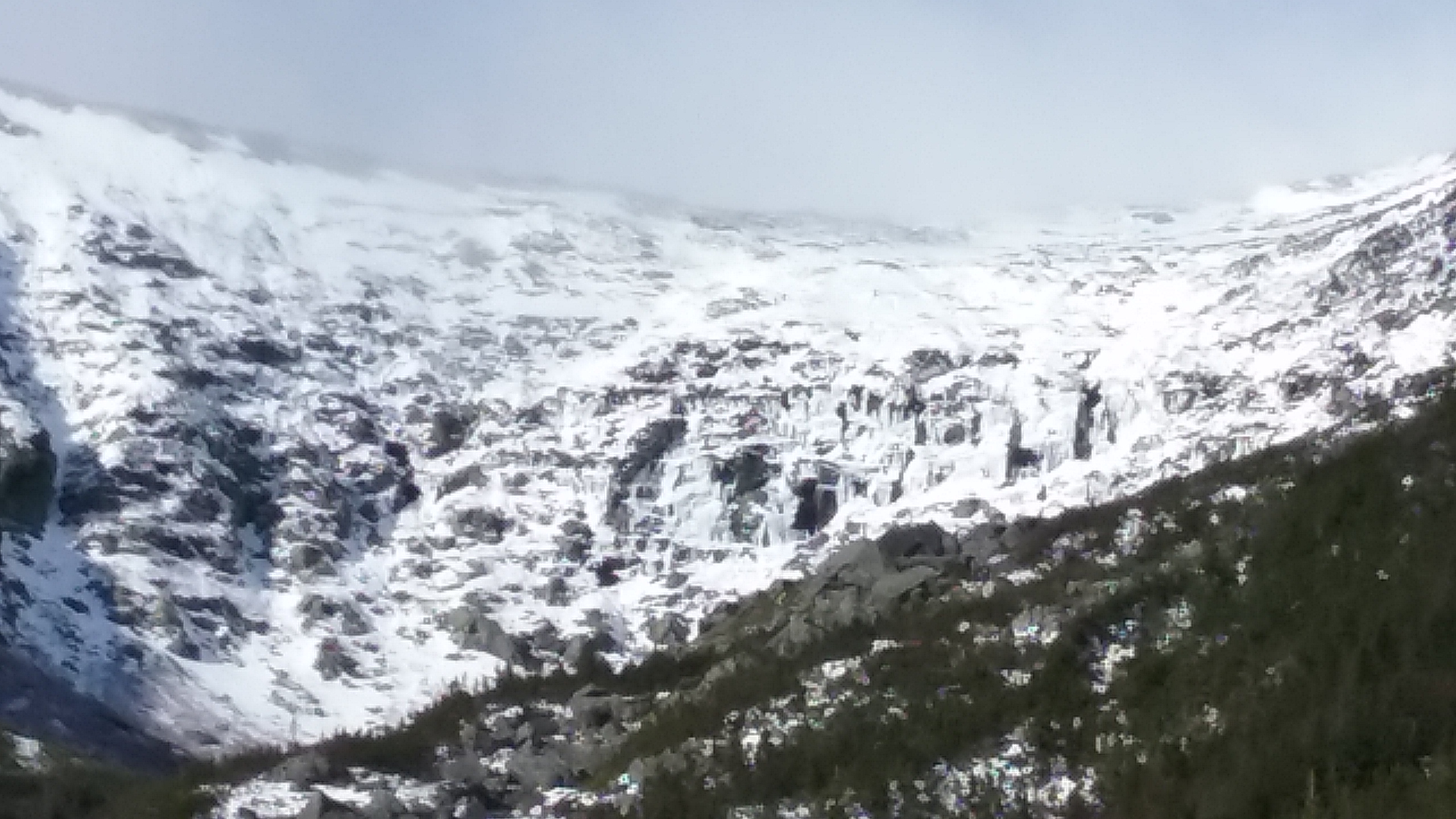 Headwall area with loads of ice with varying degrees of holding power. No doubt the cliff will shed some ice this week.
